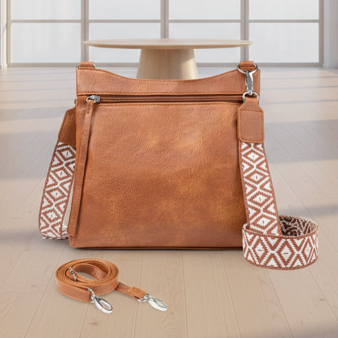 Women's small brown crossbody bag with multiple pockets and two adjustable shoulder straps for everyday use